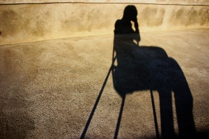 stockvault-shadow-of-a-sitting-person98721-300x200